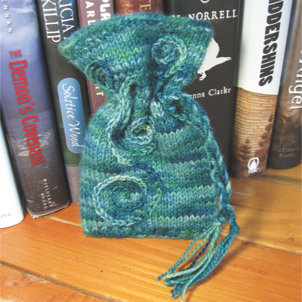 variegated aqua knitted pouch embroidered with aqua spirals