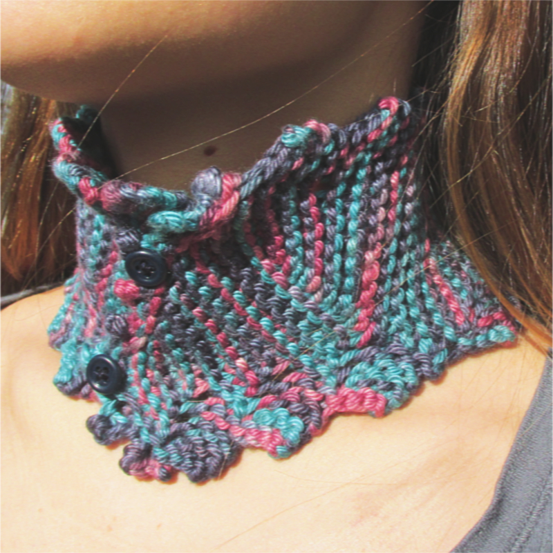 pink and blue knitted collar with dark blue buttons