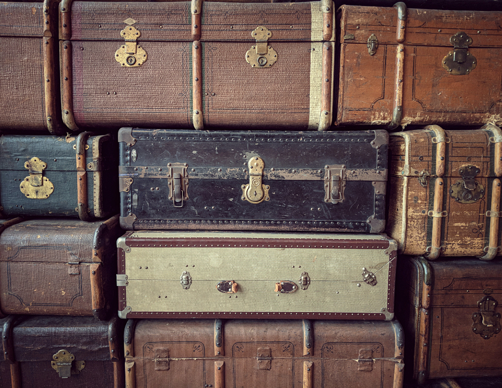a stack of vintage suitcases