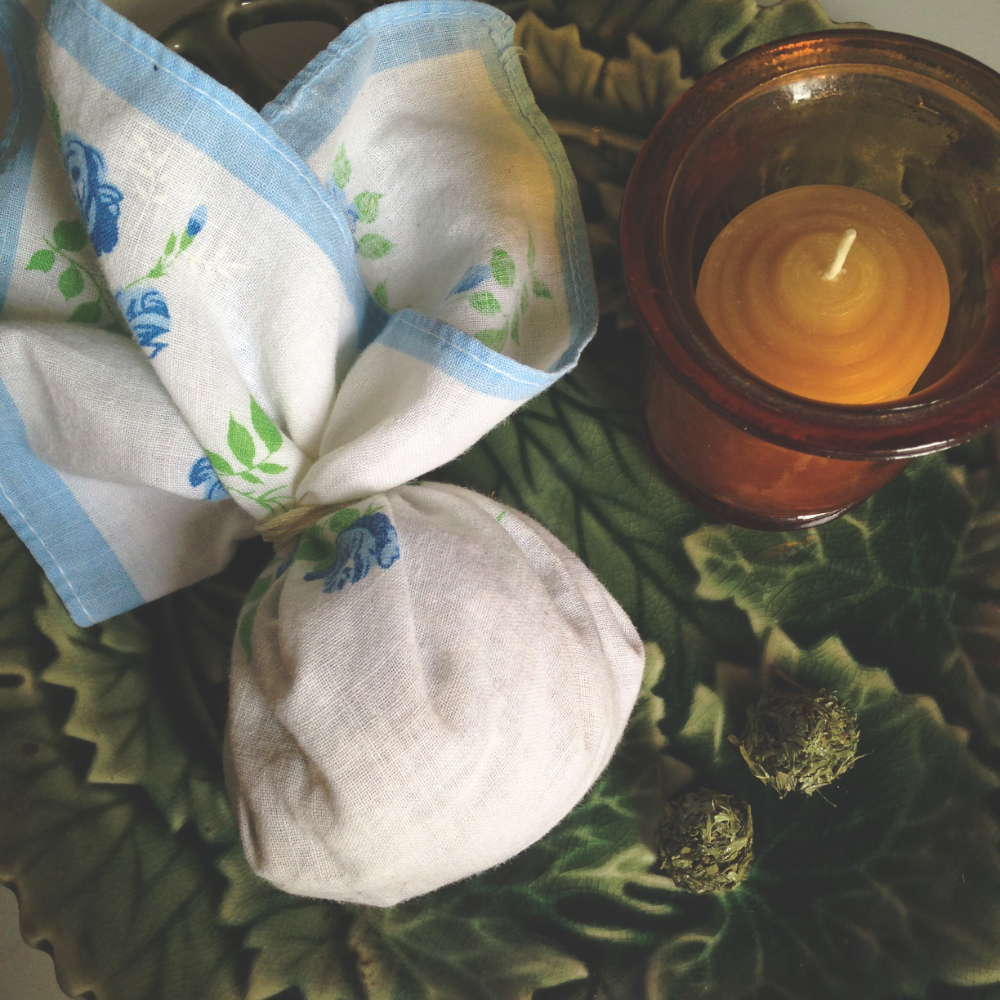 a handkerchief tied into a pouch full of herbs