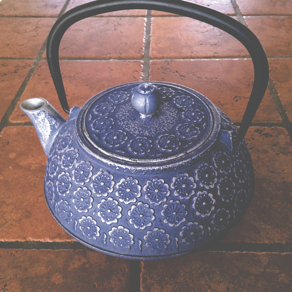a cast iron tea pot