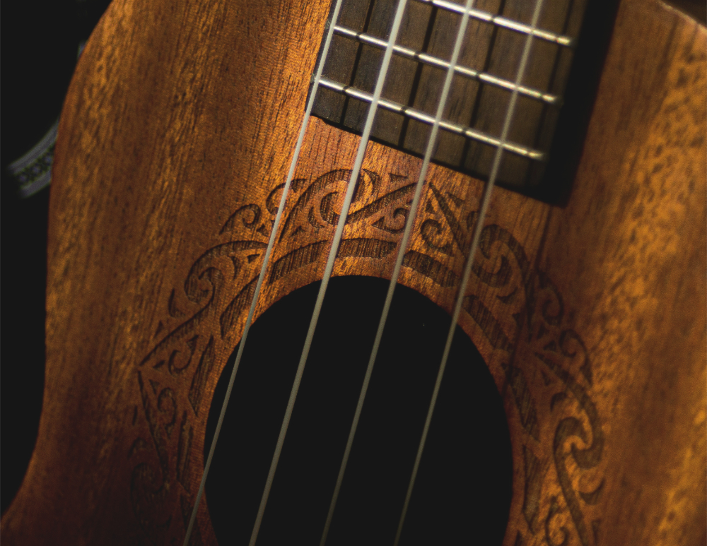 Closeup of the sound hole of a guitar